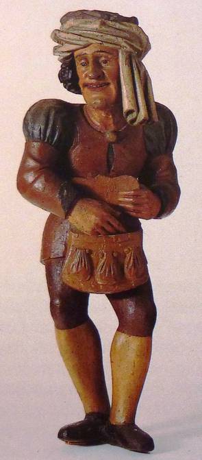 „Abgaben zahlender Bauer. Holzfigur, um 1534. Rathaus Überlingen.