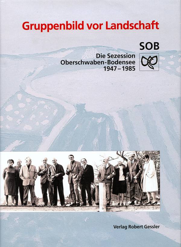 „Gruppenbild vor Landschaft“.